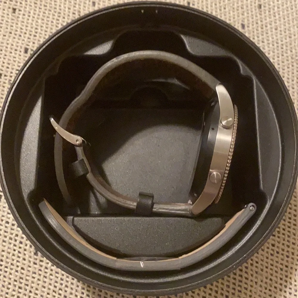 Silver Samsung Gear series 3 watch with black strap